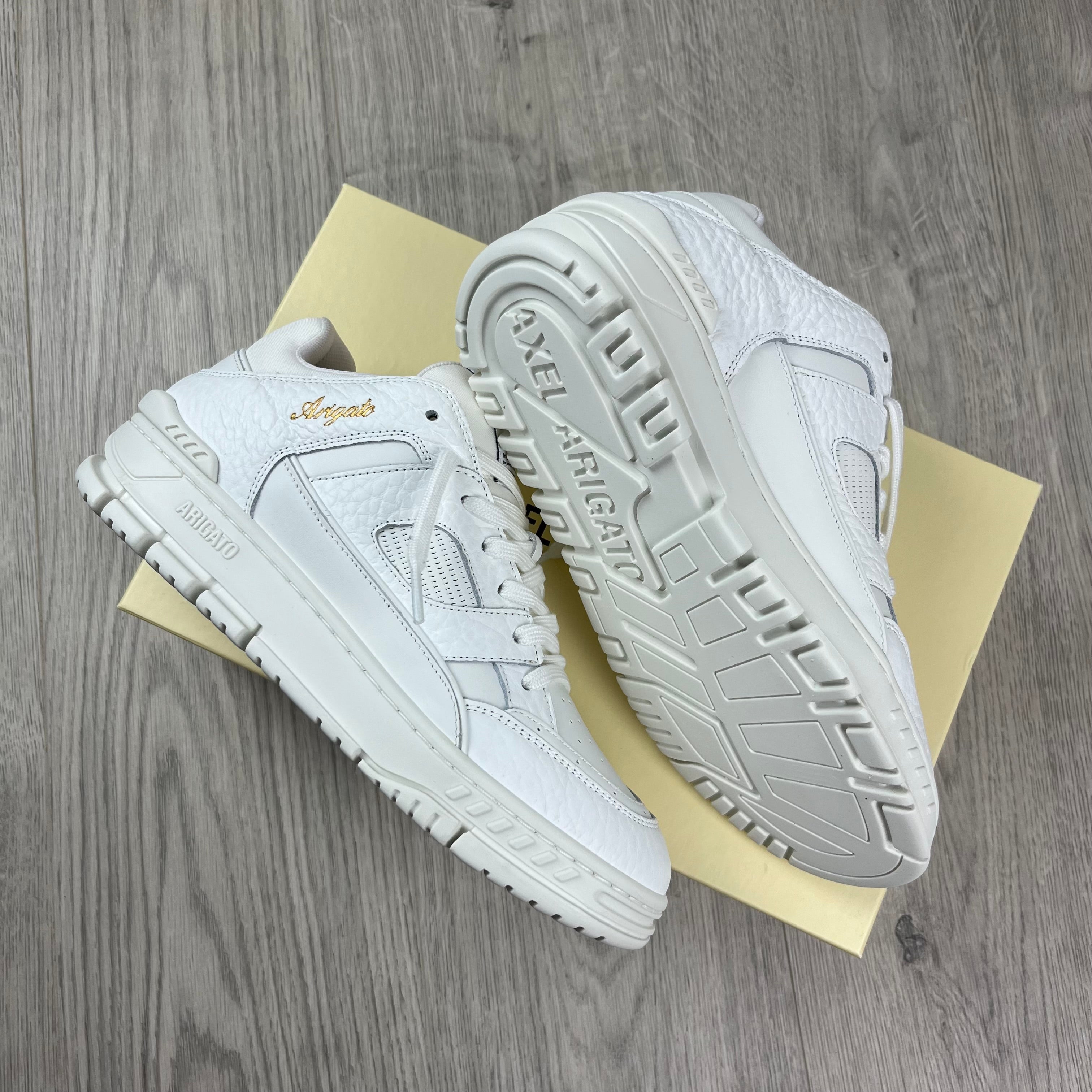 Men's Axel Arigato Arena Lo Sneakers in White. On sale at Open Attire.