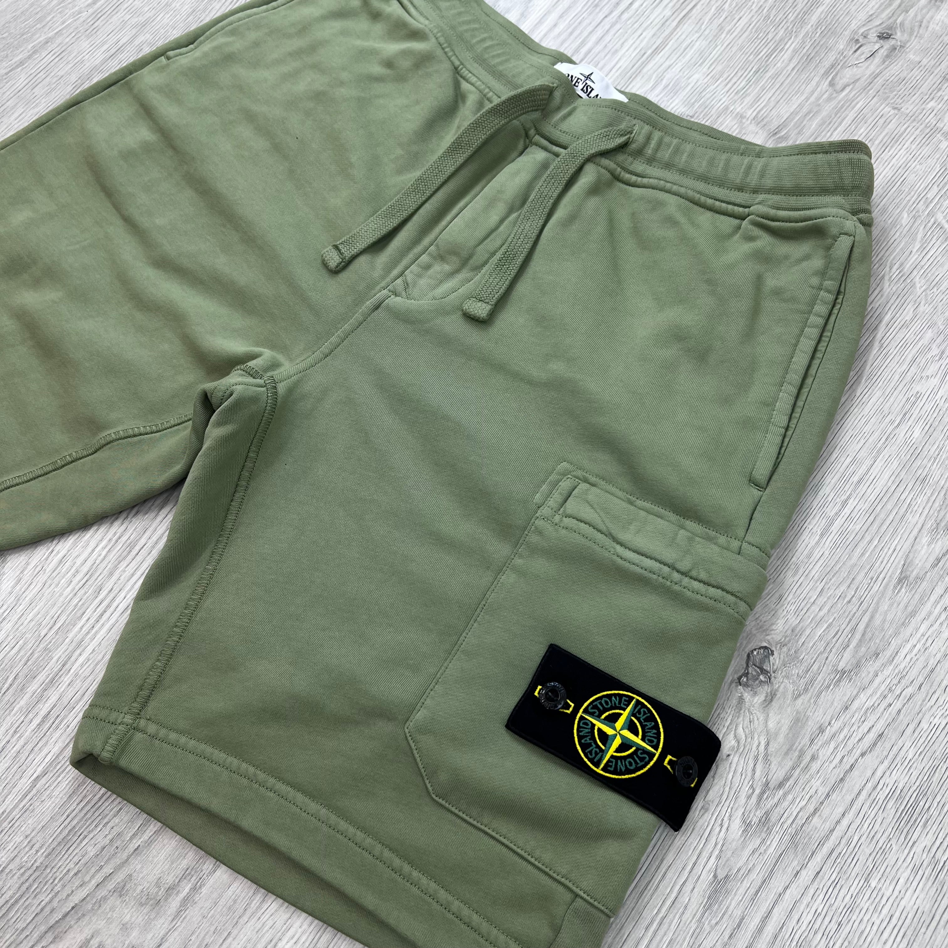 Angled view of the Stone Island Jersey Shorts in Laurel Green.