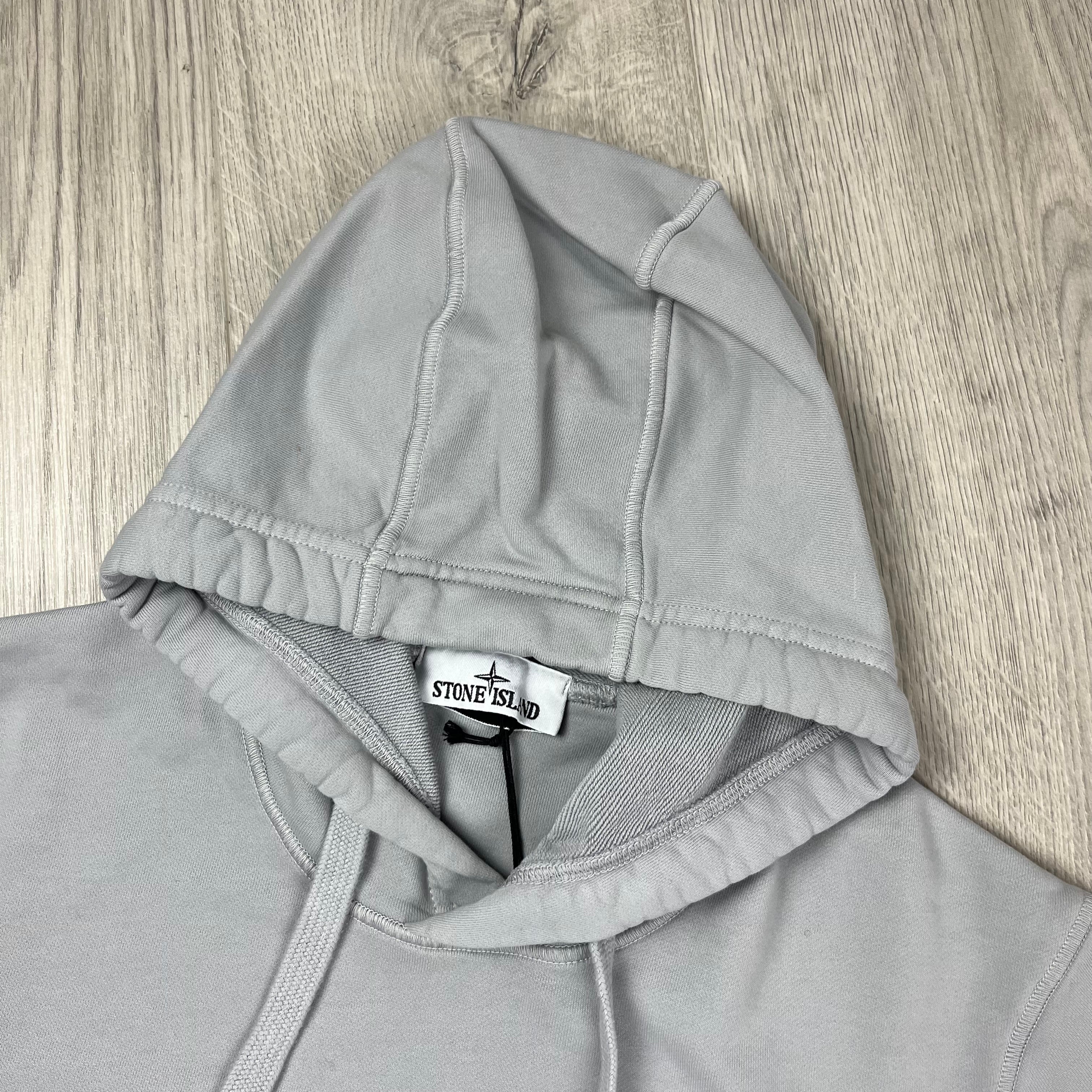 Stone Island Dyed Cotton Hoodie in Pearl Grey. On sale at Open Attire.