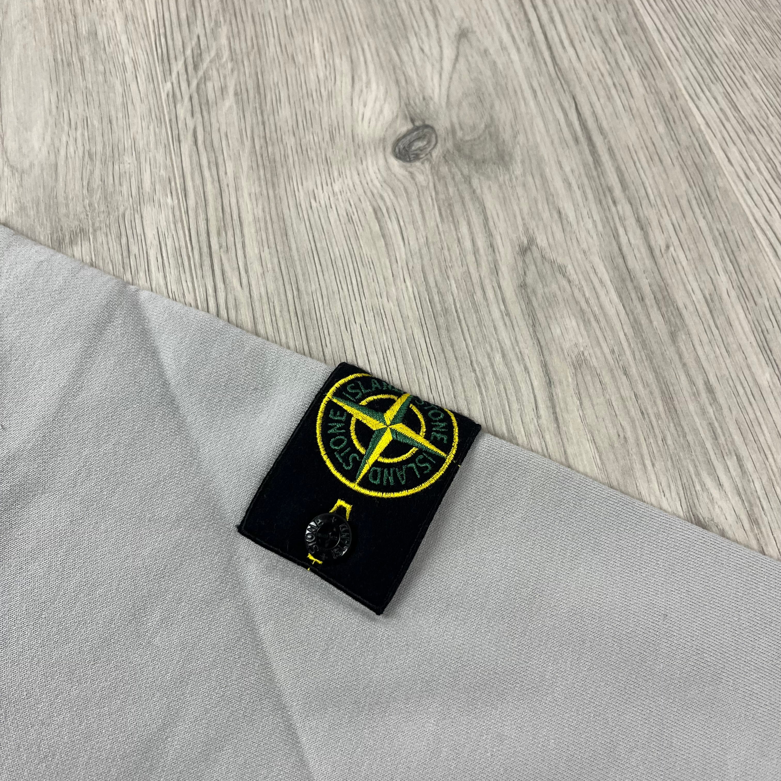 Stone Island Dyed Cotton Sweatshirt in Pearl Grey. On sale at Open Attire.