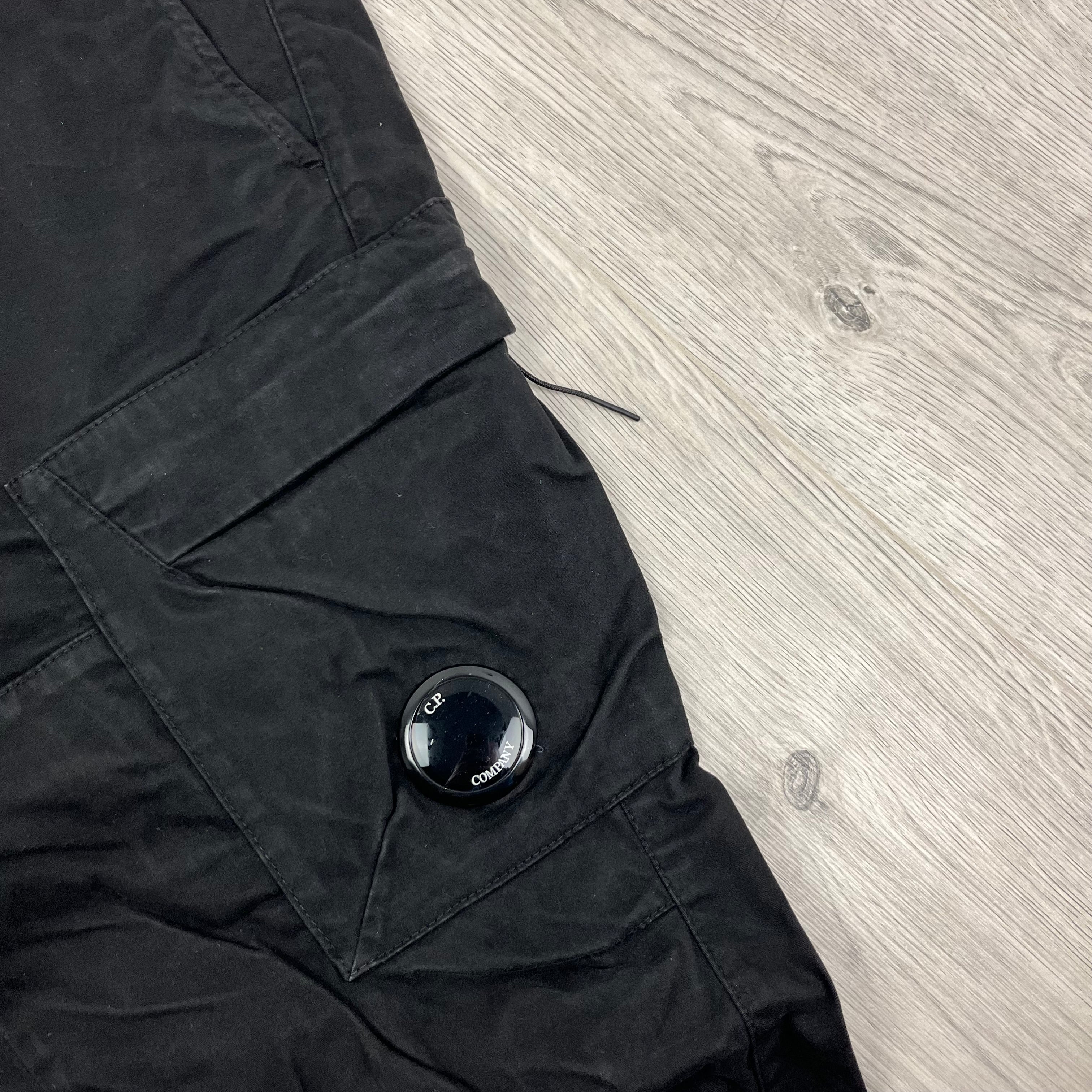 CP Company Stretch Sateen Ergonomic Lens Cargo Pants in Black. On sale at Open Attire.