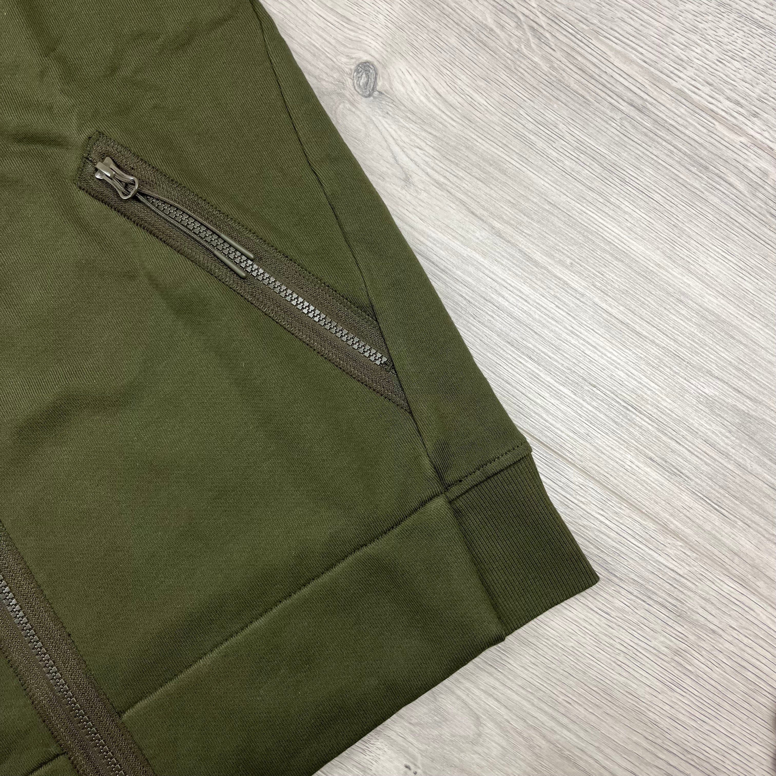 CP Company Raised Fleece Goggle Hoodie in Ivy Green. On sale at Open Attire. 