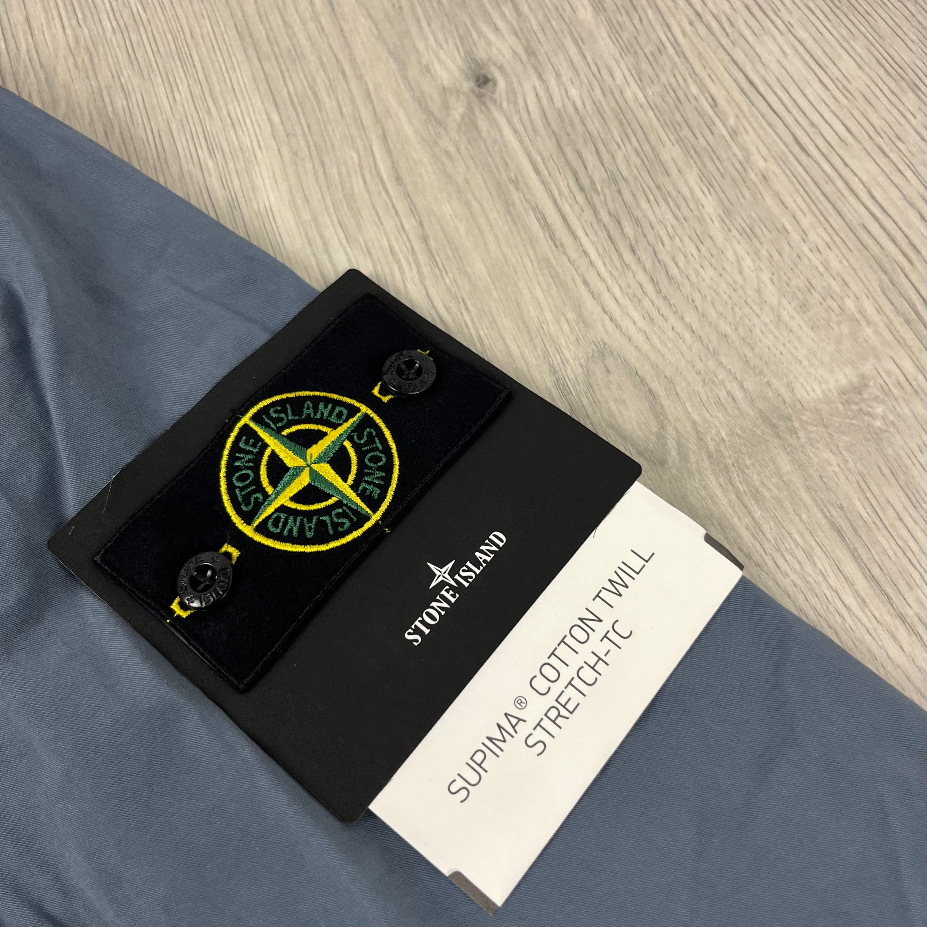 Men's Stone Island Supima Hooded Overshirt in Avio Blue. On sale at Open Attire.