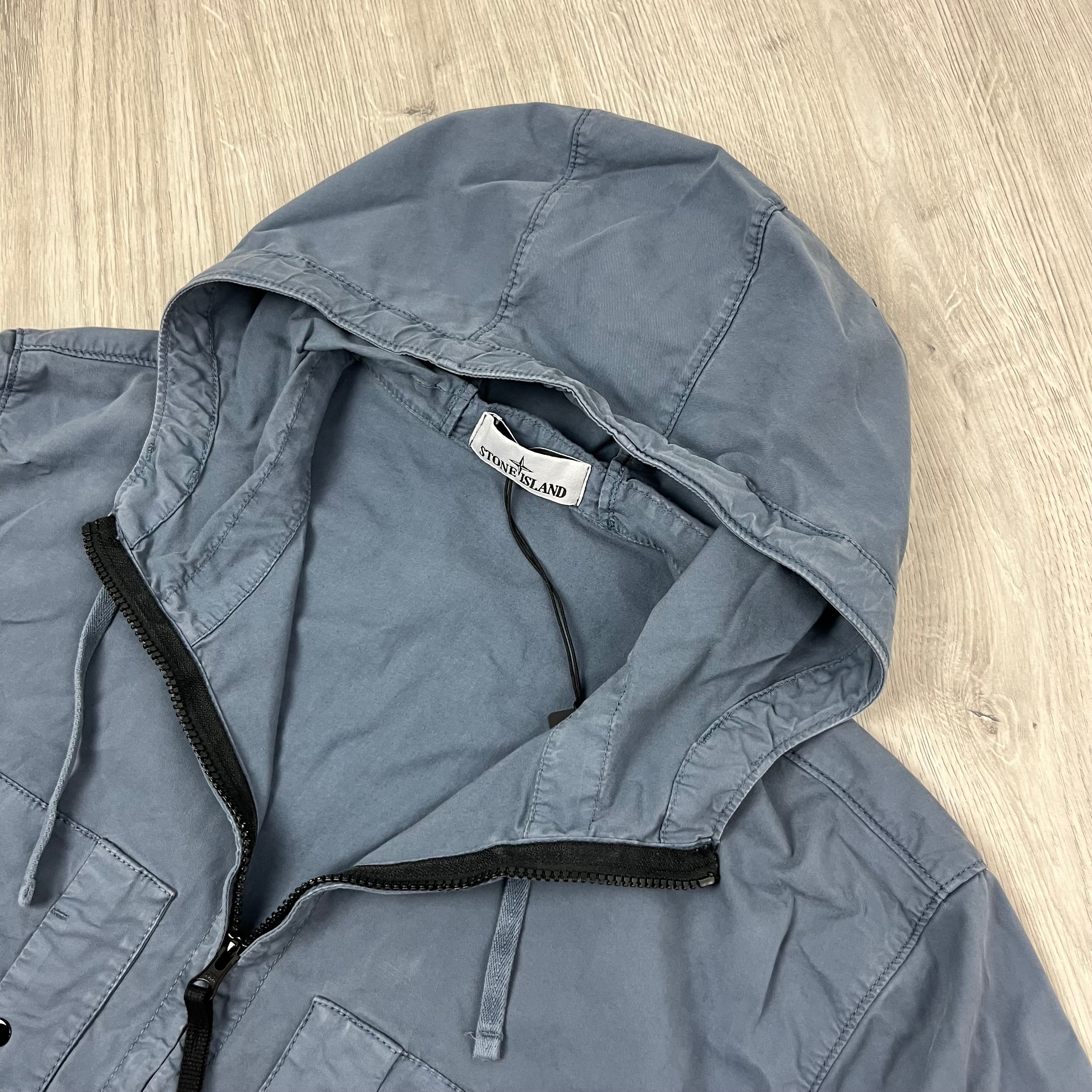 Men's Stone Island Supima Hooded Overshirt in Avio Blue. On sale at Open Attire.