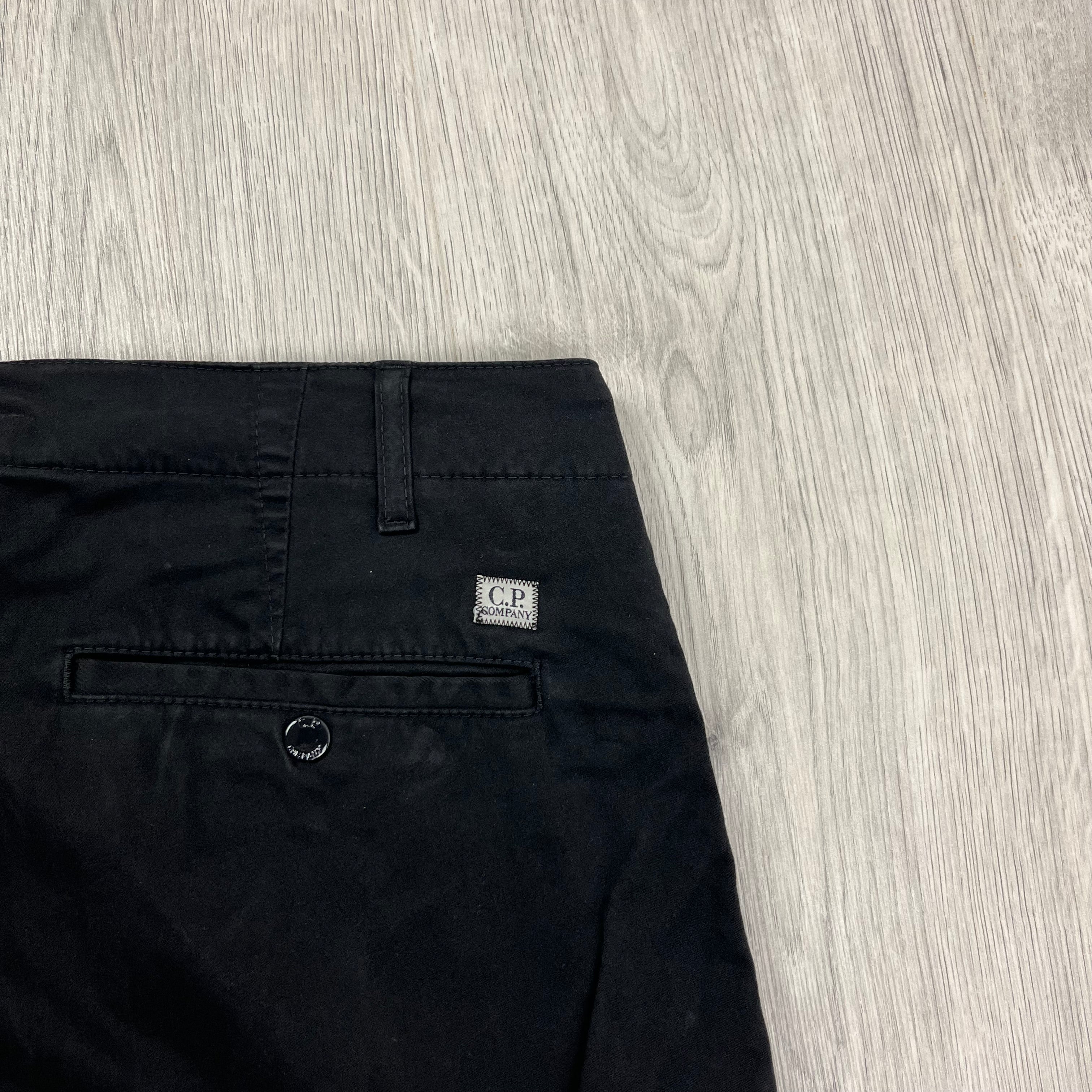 CP Company Stretch Sateen Ergonomic Lens Cargo Pants in Black. On sale at Open Attire.