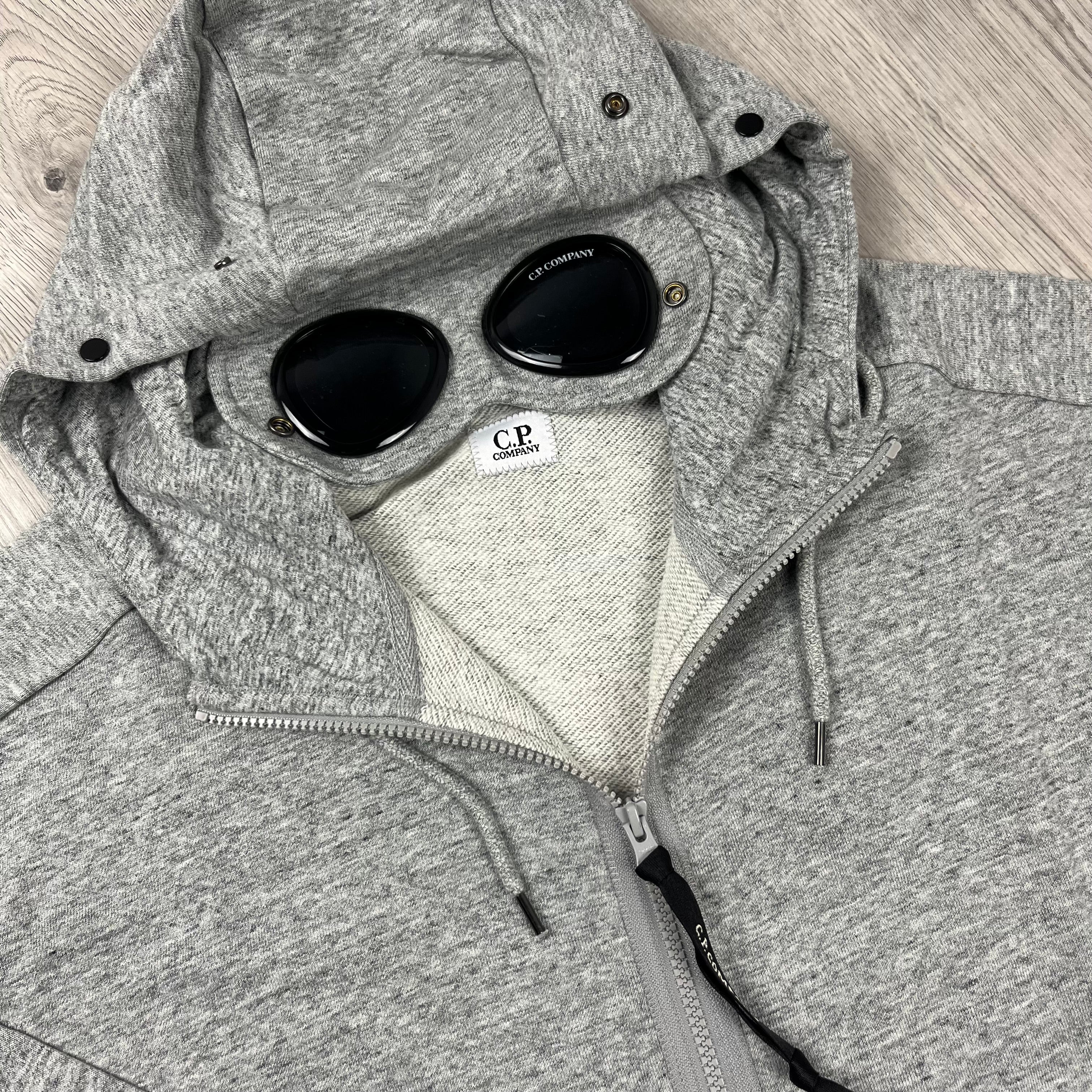 CP Company Raised Fleece Goggle Hoodie in Greystone Melange. On sale at Open Attire. 