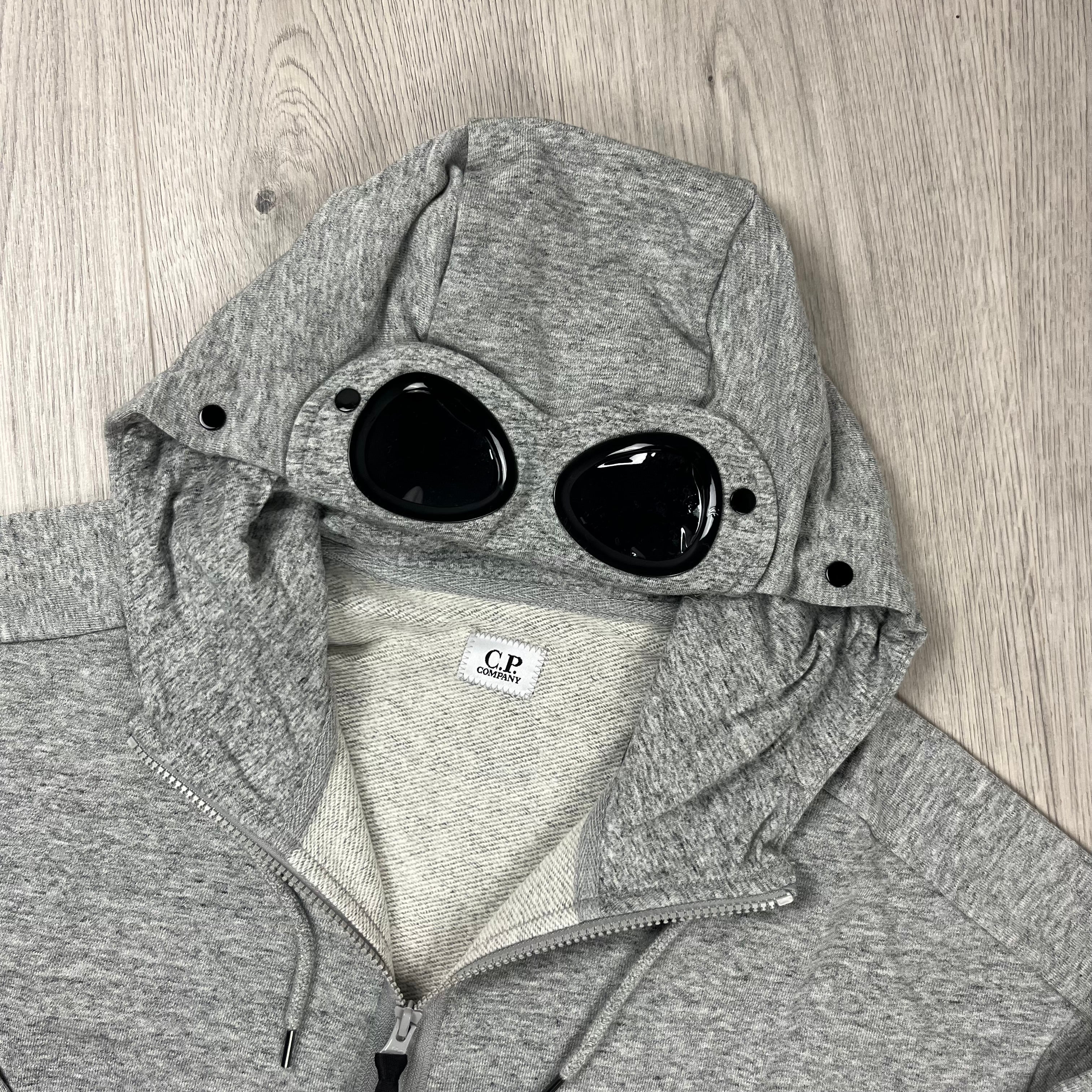 CP Company Raised Fleece Goggle Hoodie in Greystone Melange. On sale at Open Attire. 