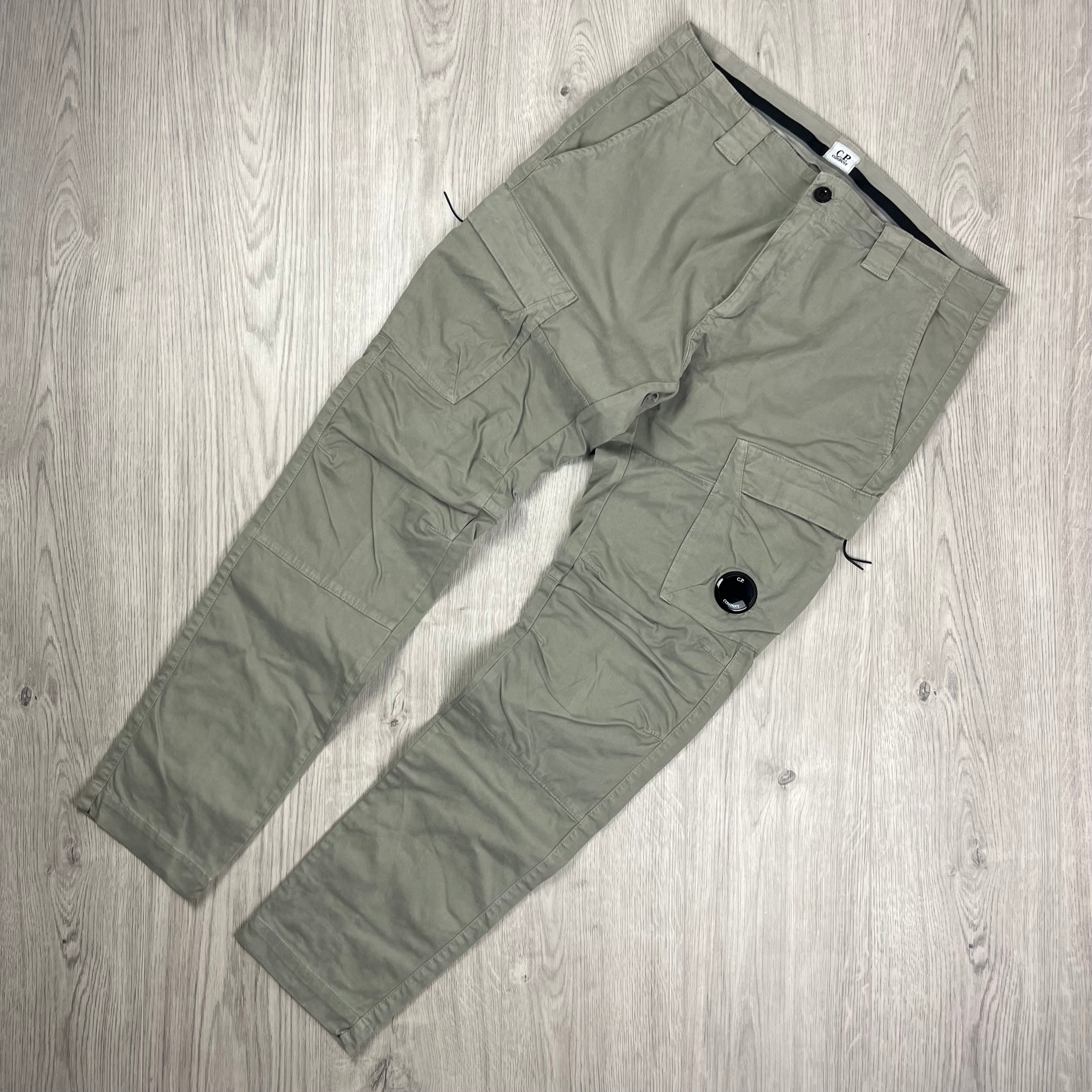 CP Company Stretch Sateen Ergonomic Lens Cargo Pants in Vintage Khaki. On sale at Open Attire.