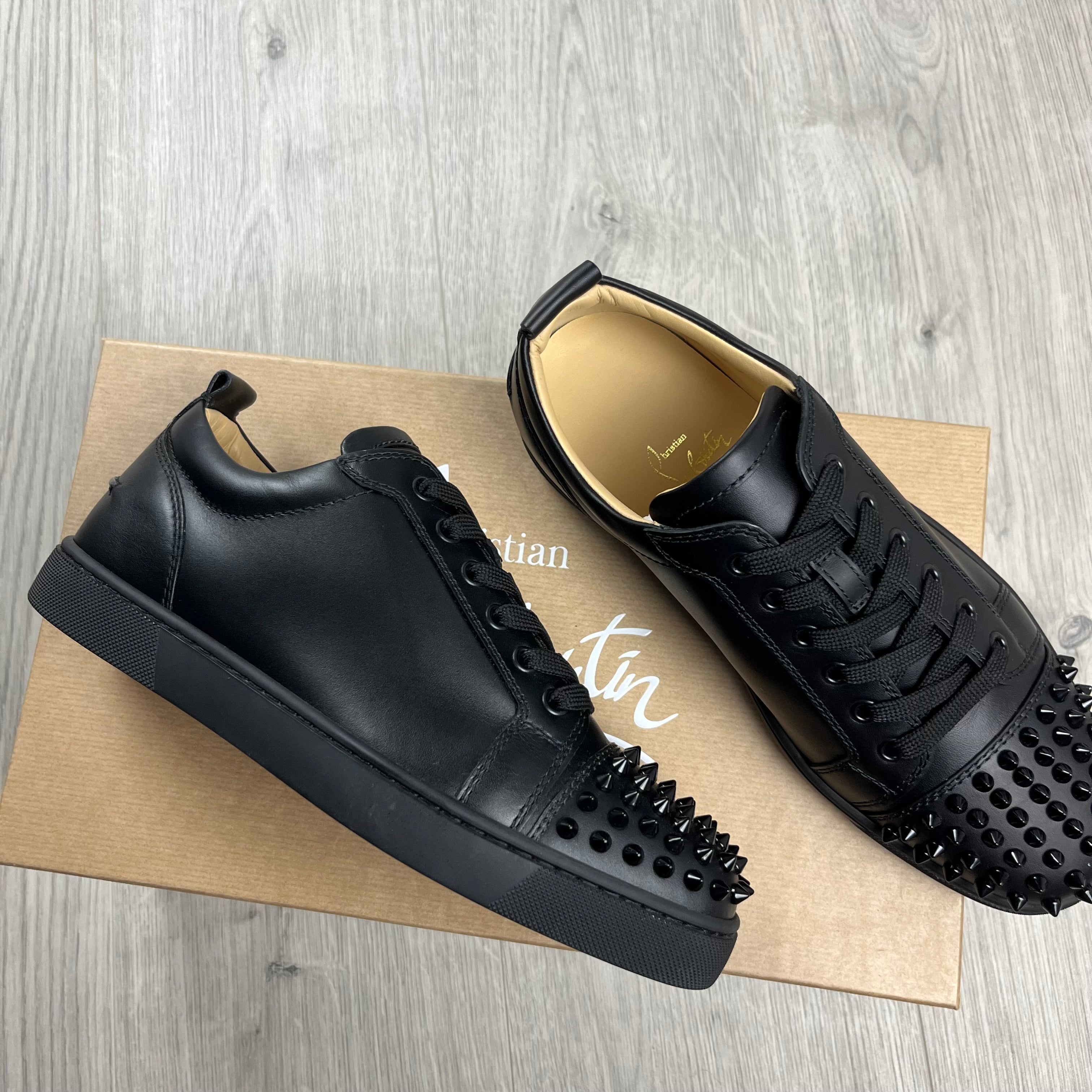 Christian Louboutin Louis Junior Sneakers in Black. On sale at Open Attire.