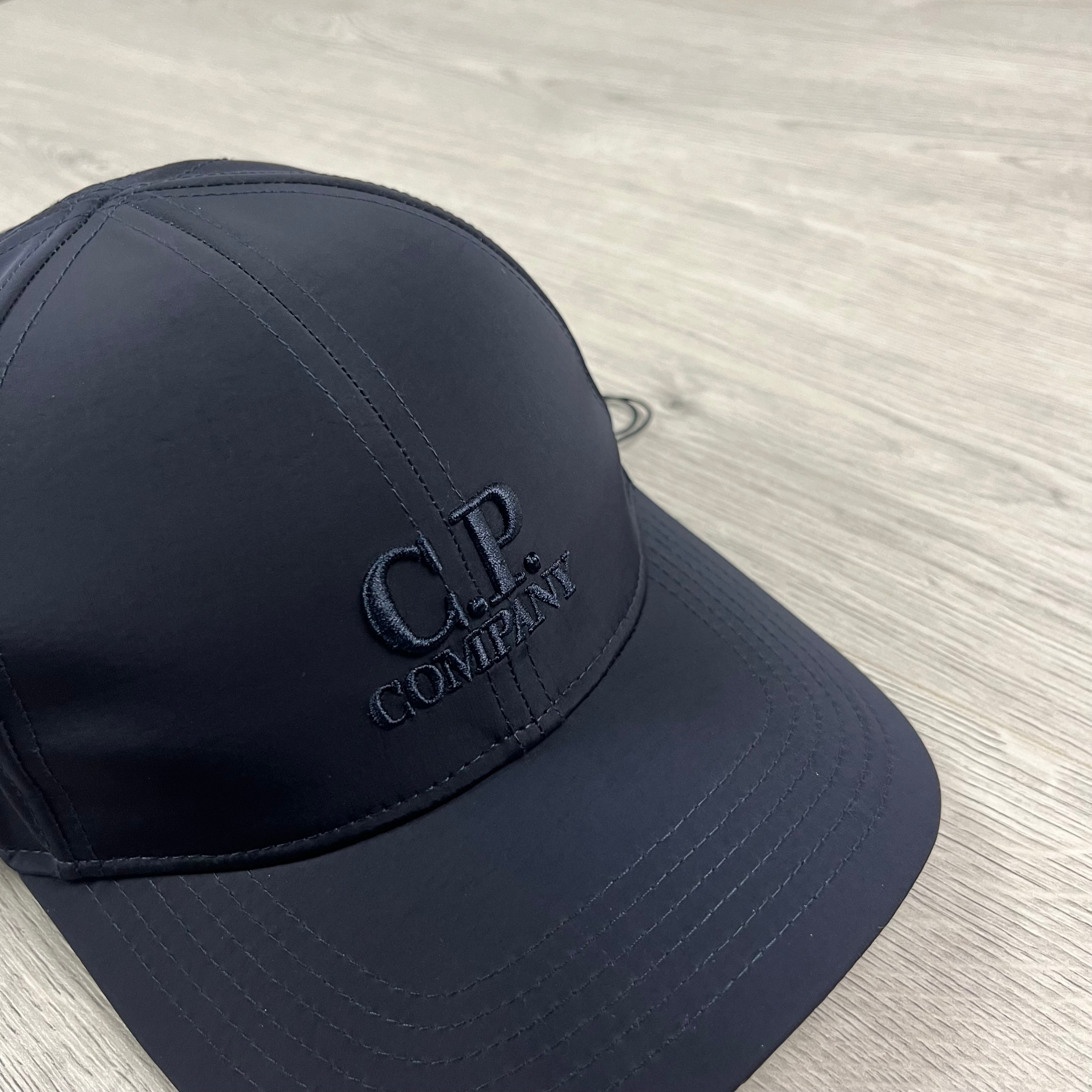 CP Company Chrome-R Baseball Cap in Total Eclipse Navy Blue. On sale at Open Attire.