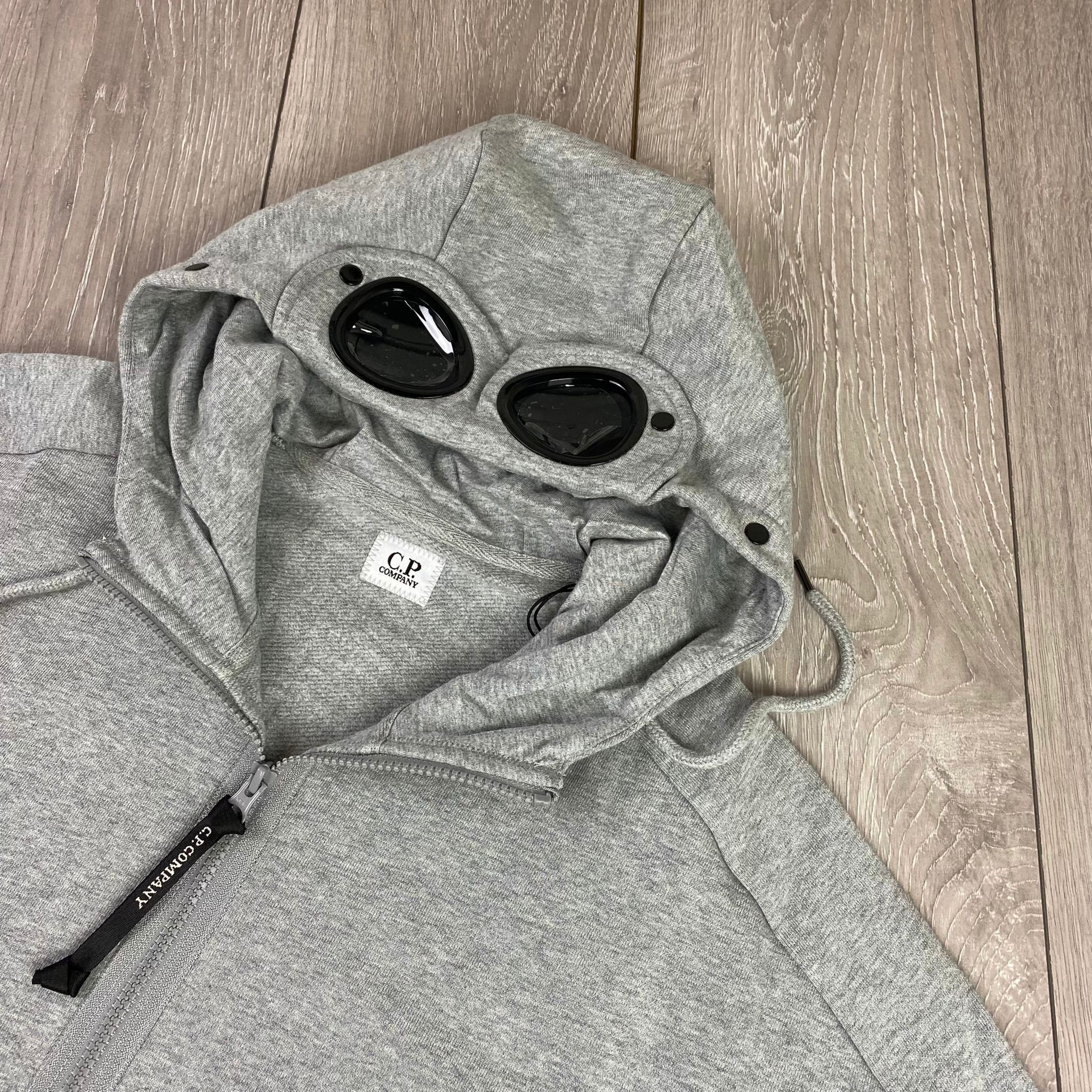 CP Company Raised Fleece Goggle Hoodie in Grey Melange. On sale at Open Attire.