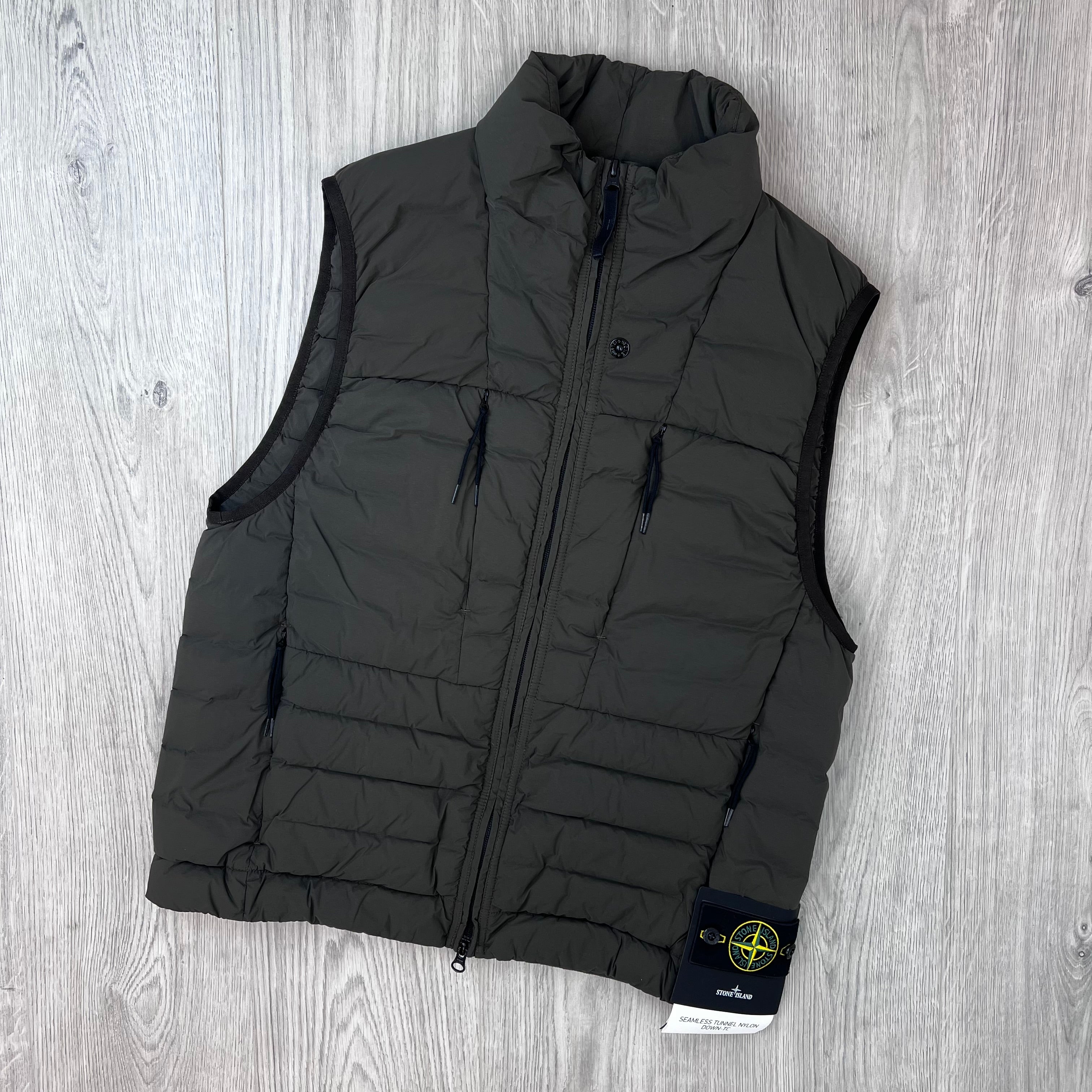 Front view of a Stone Island Seamless Tunnel Nylon Down-TC Down Gilet in Coal Grey. 