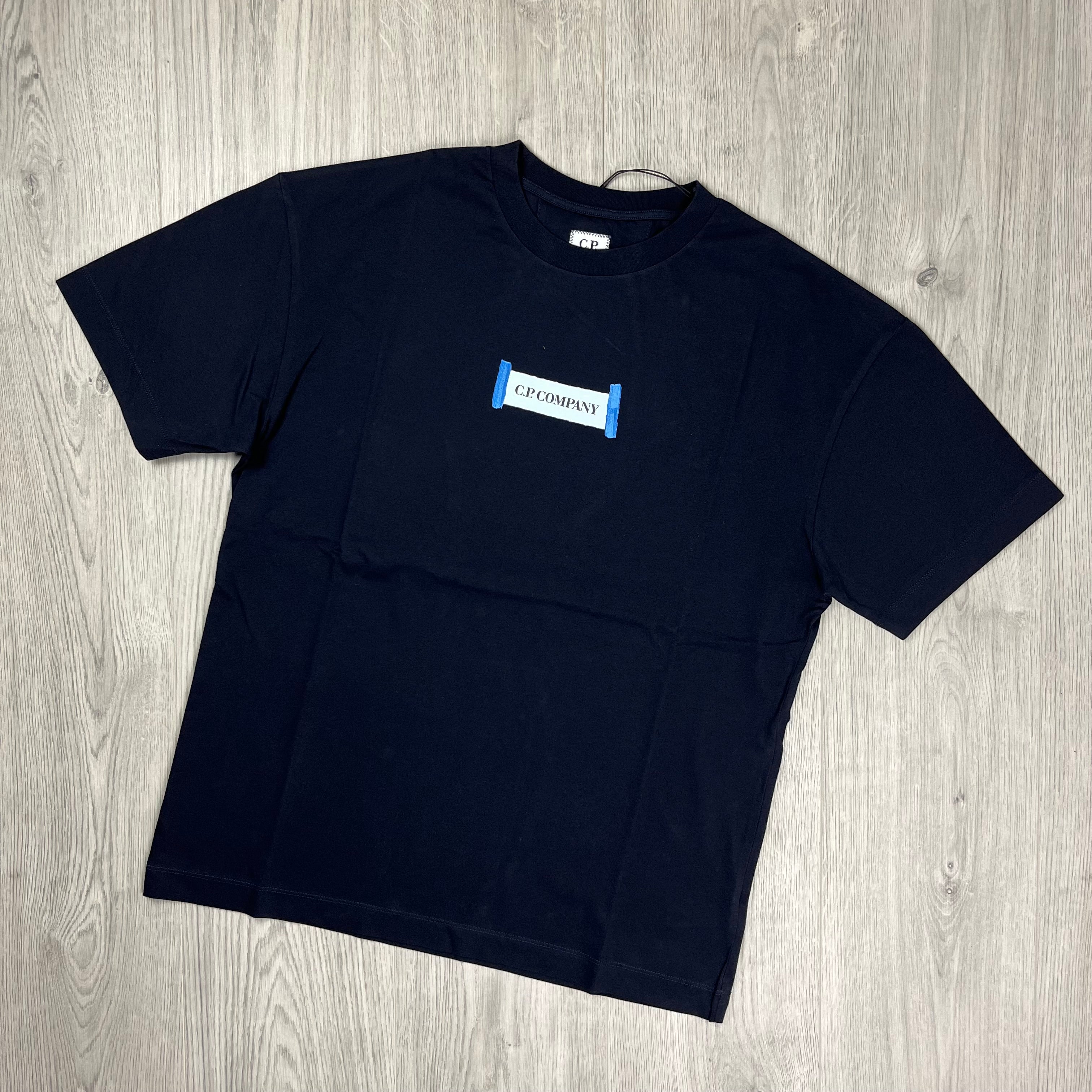 CP Company Blurred Logo T-Shirt in Total Eclipse Navy Blue. On sale at Open Attire.