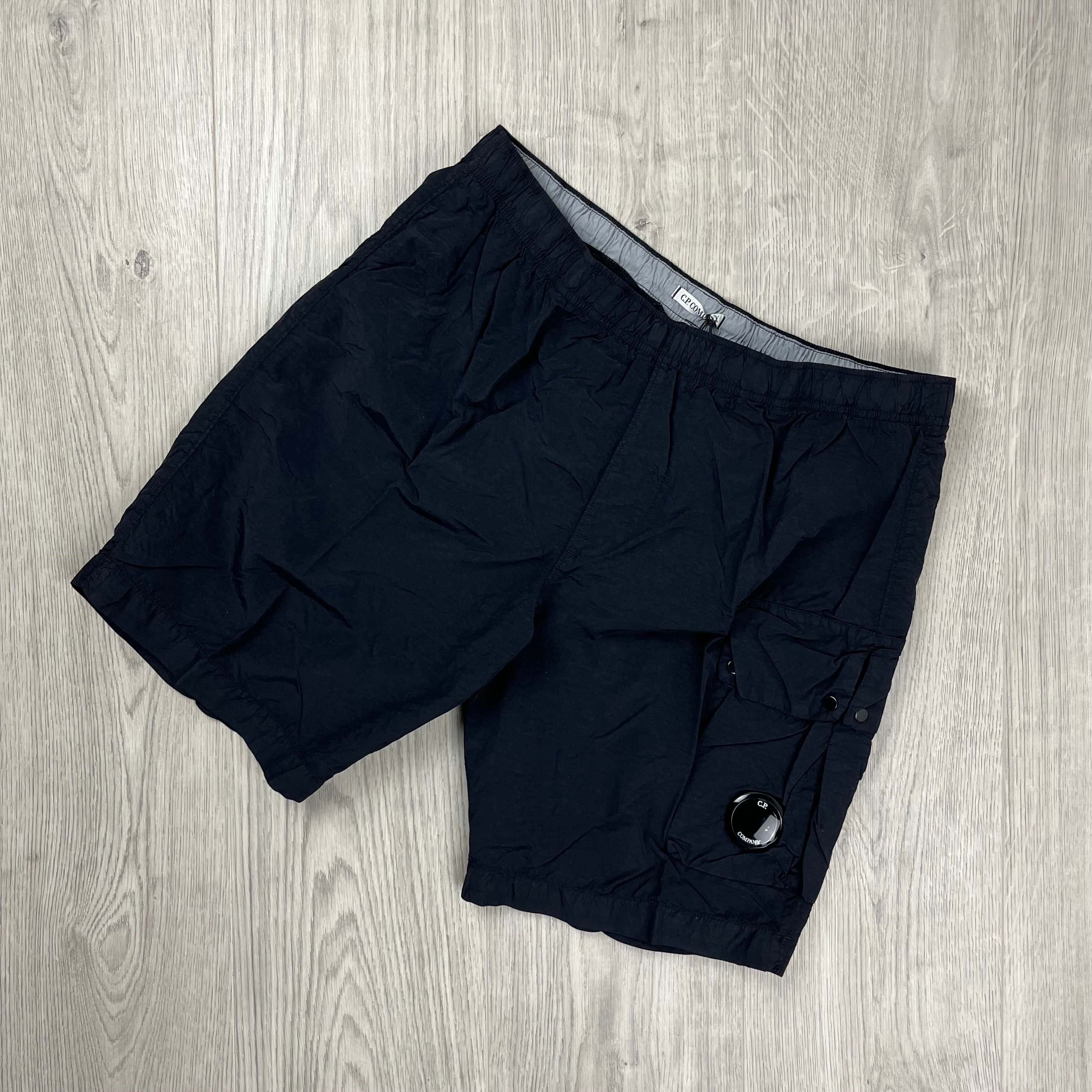 CP Company Flatt Nylon Lens Swim Shorts in Black. On sale at Open Attire.