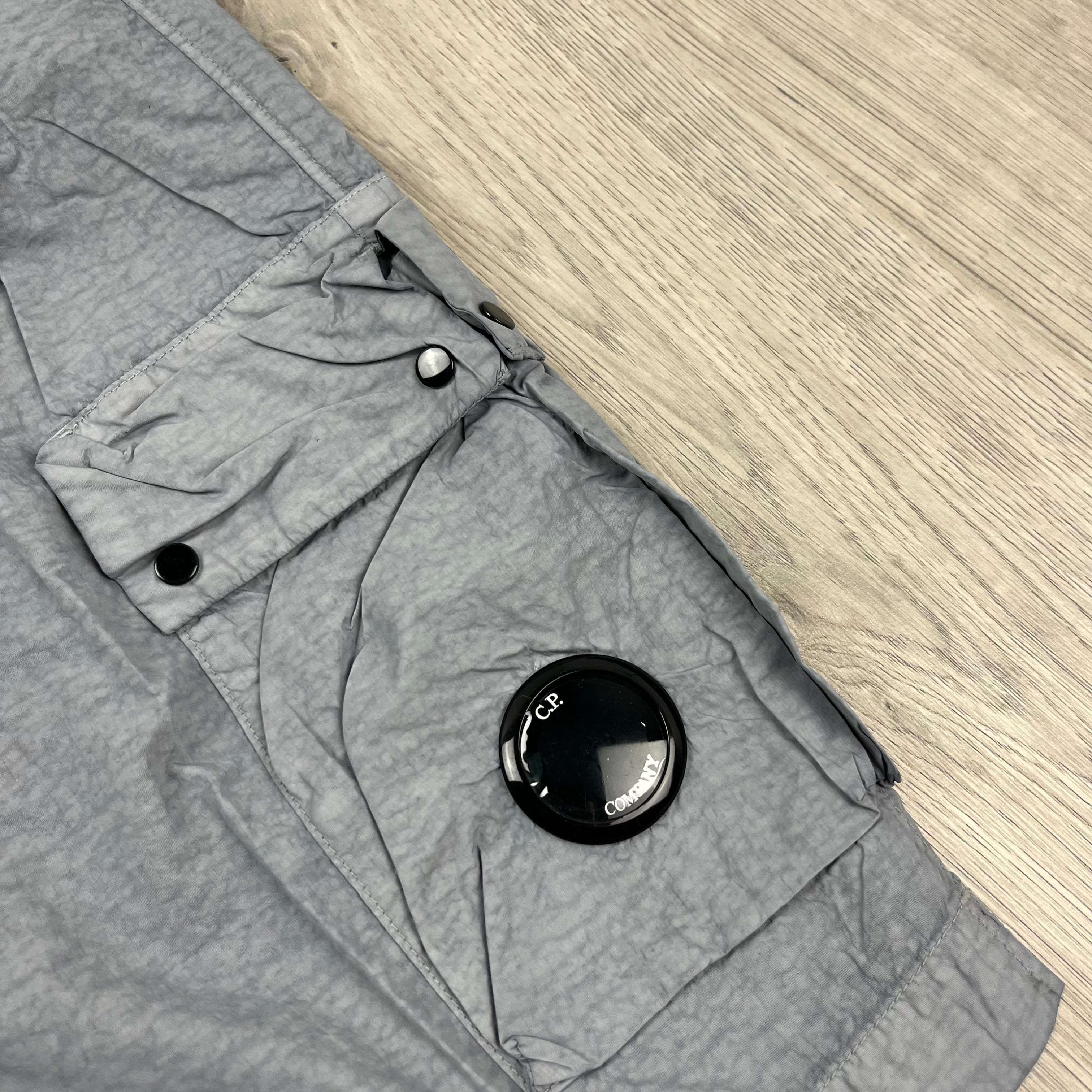 CP Company Flatt Nylon Lens Swim Shorts in Limestone Grey. On sale at Open Attire.