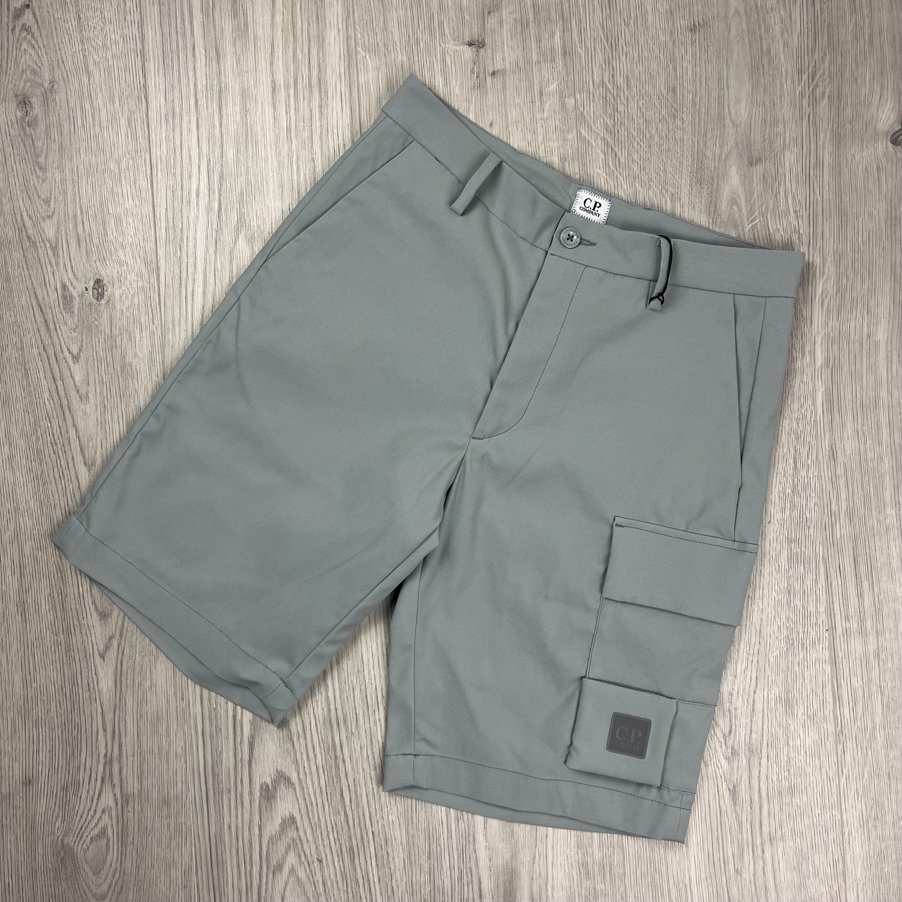 CP Company Metropolis Series Technical Panama Cargo Shorts in Limestone. On sale at Open Attire.