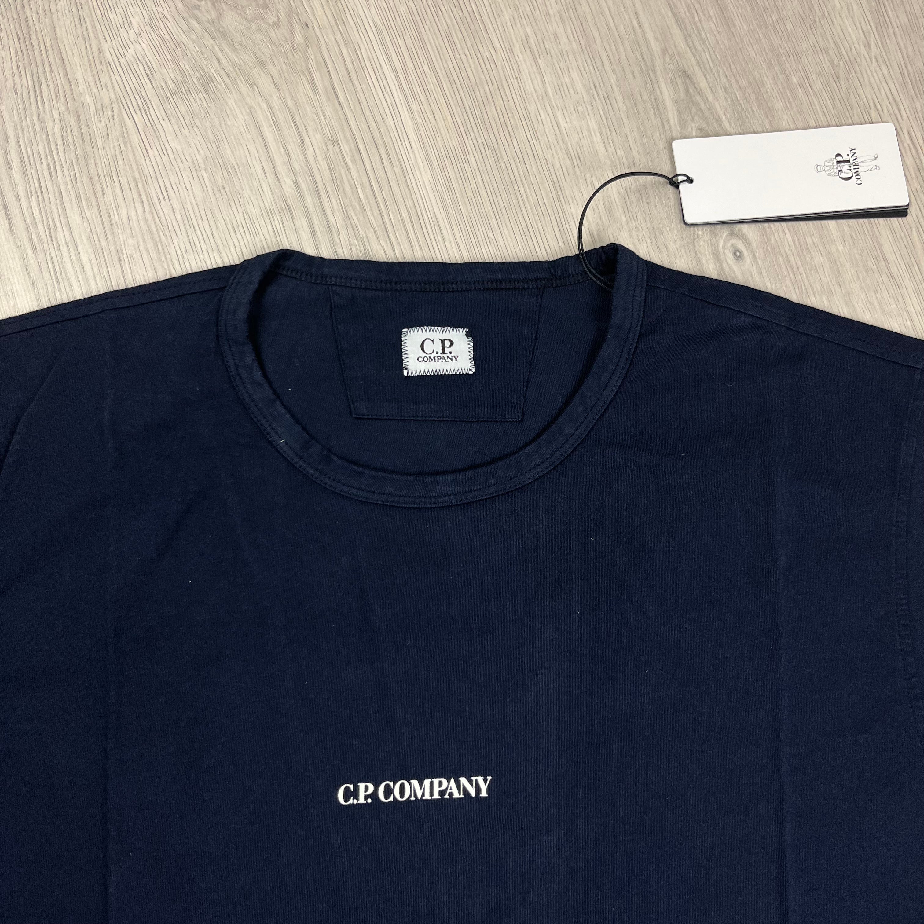 CP Company Printed T-Shirt in Total Eclipse Navy Blue. On sale at Open Attire.