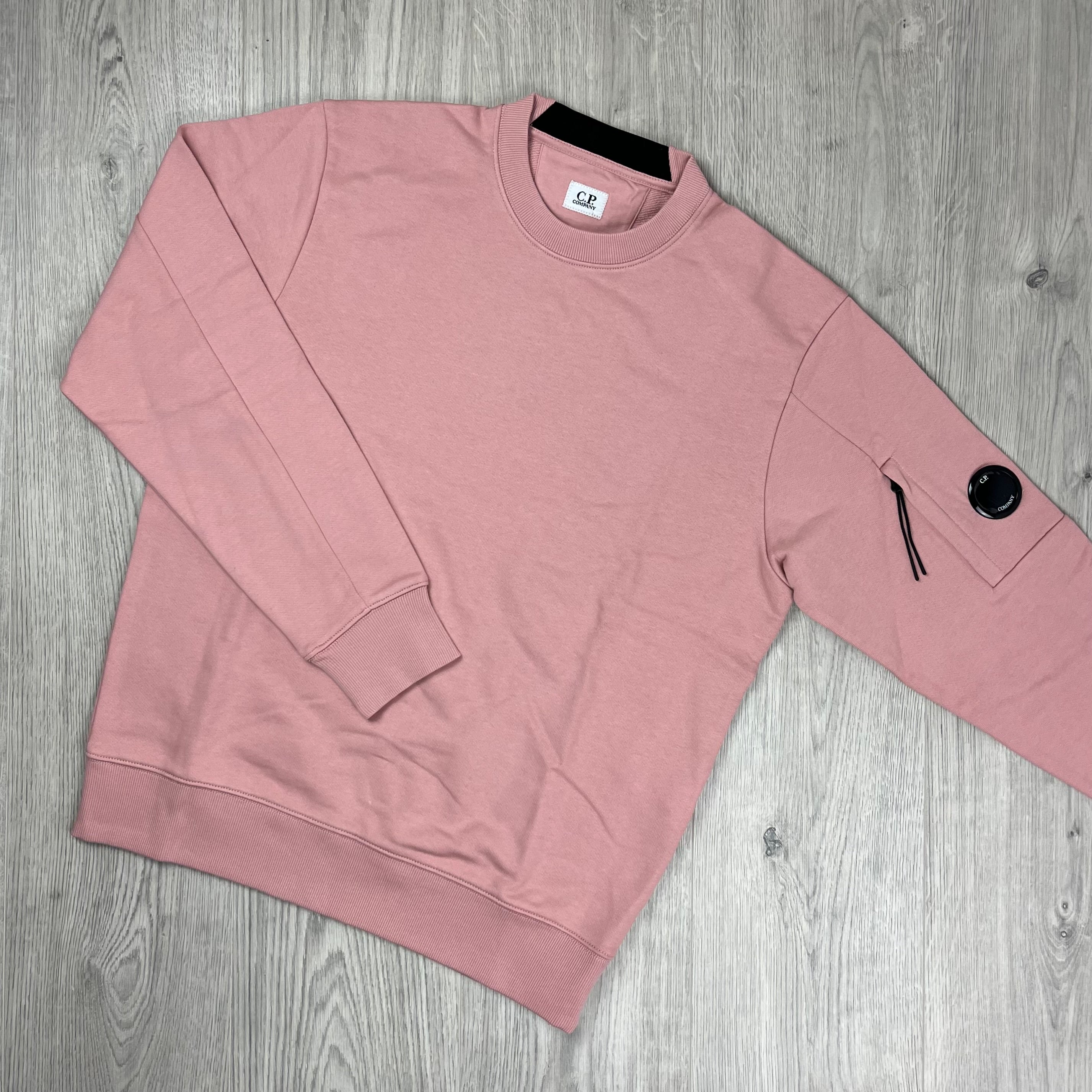 CP Company Raised Fleece Sweatshirt in Misty Rose. On sale at Open Attire.