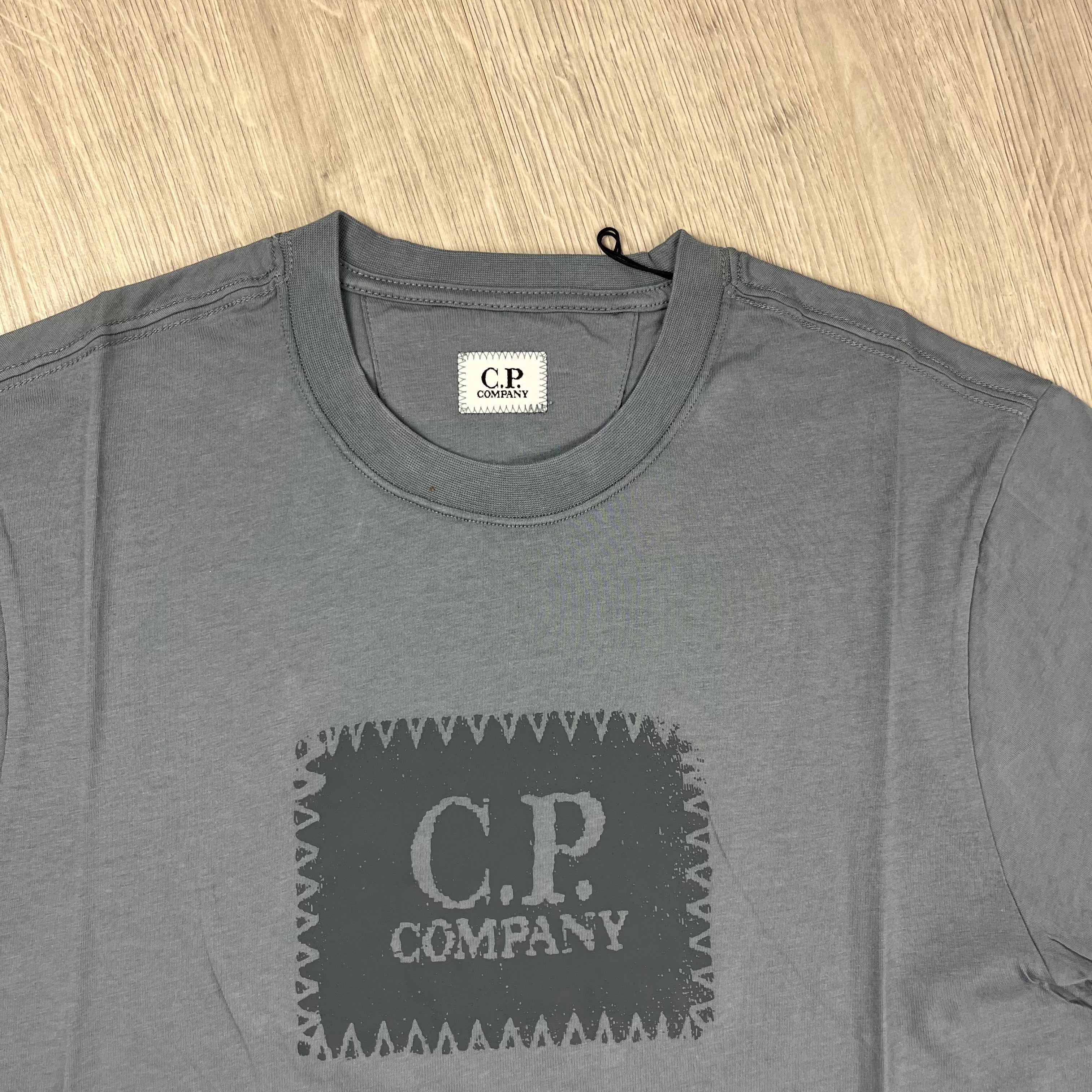 CP Company 30/1 Stamp Logo T-Shirt in Stormy Weather. On sale at Open Attire.