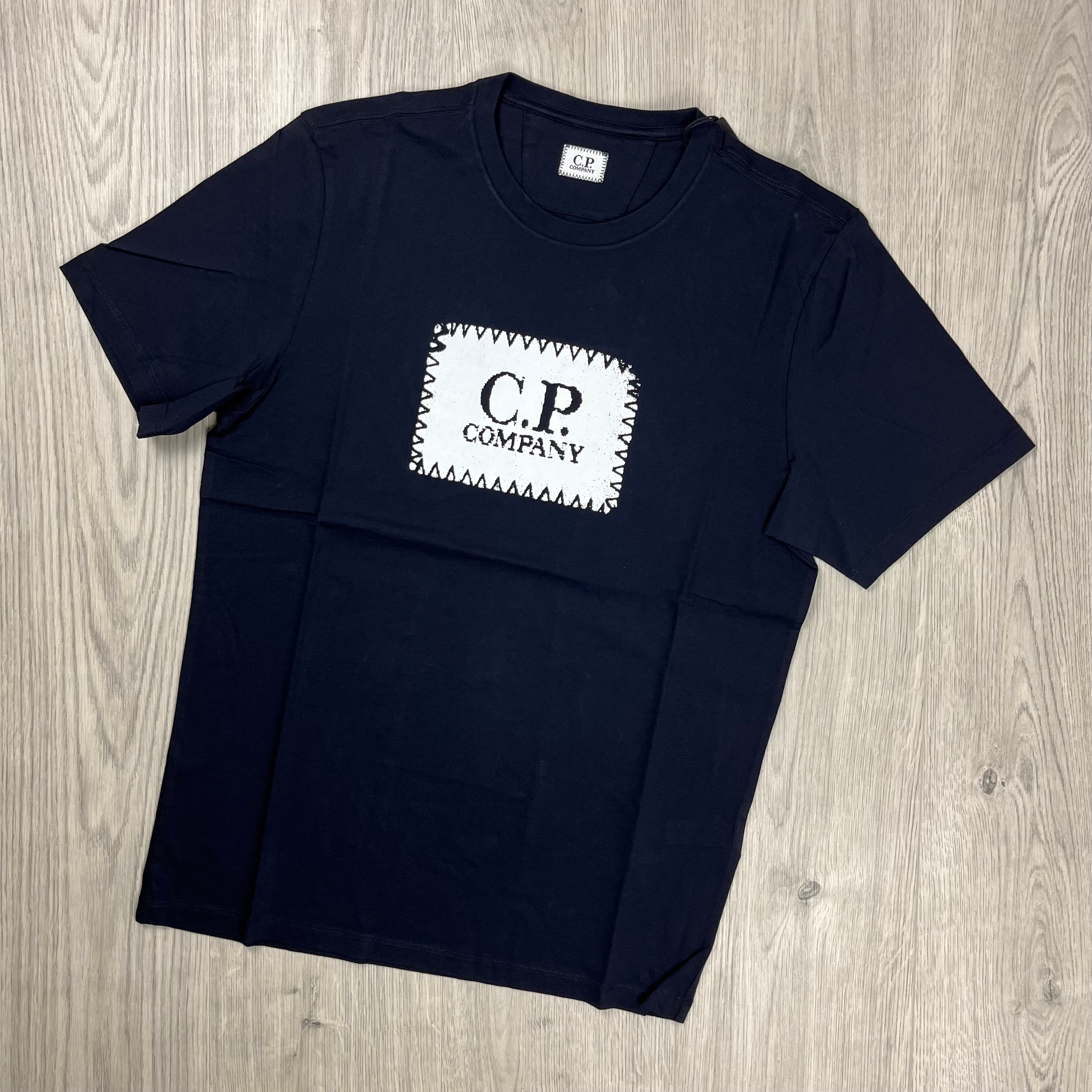 CP Company 30/1 Stamp Logo T-Shirt in Total Eclipse Navy Blue. On sale at Open Attire.