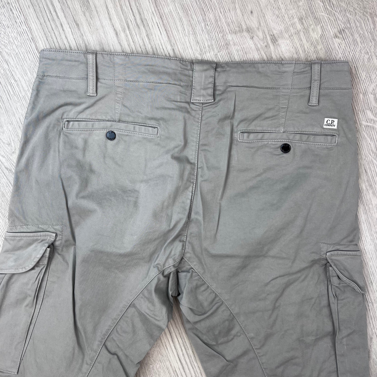 Rear view of the CP Company Stretch Sateen Cargo Trousers in Flint Grey.