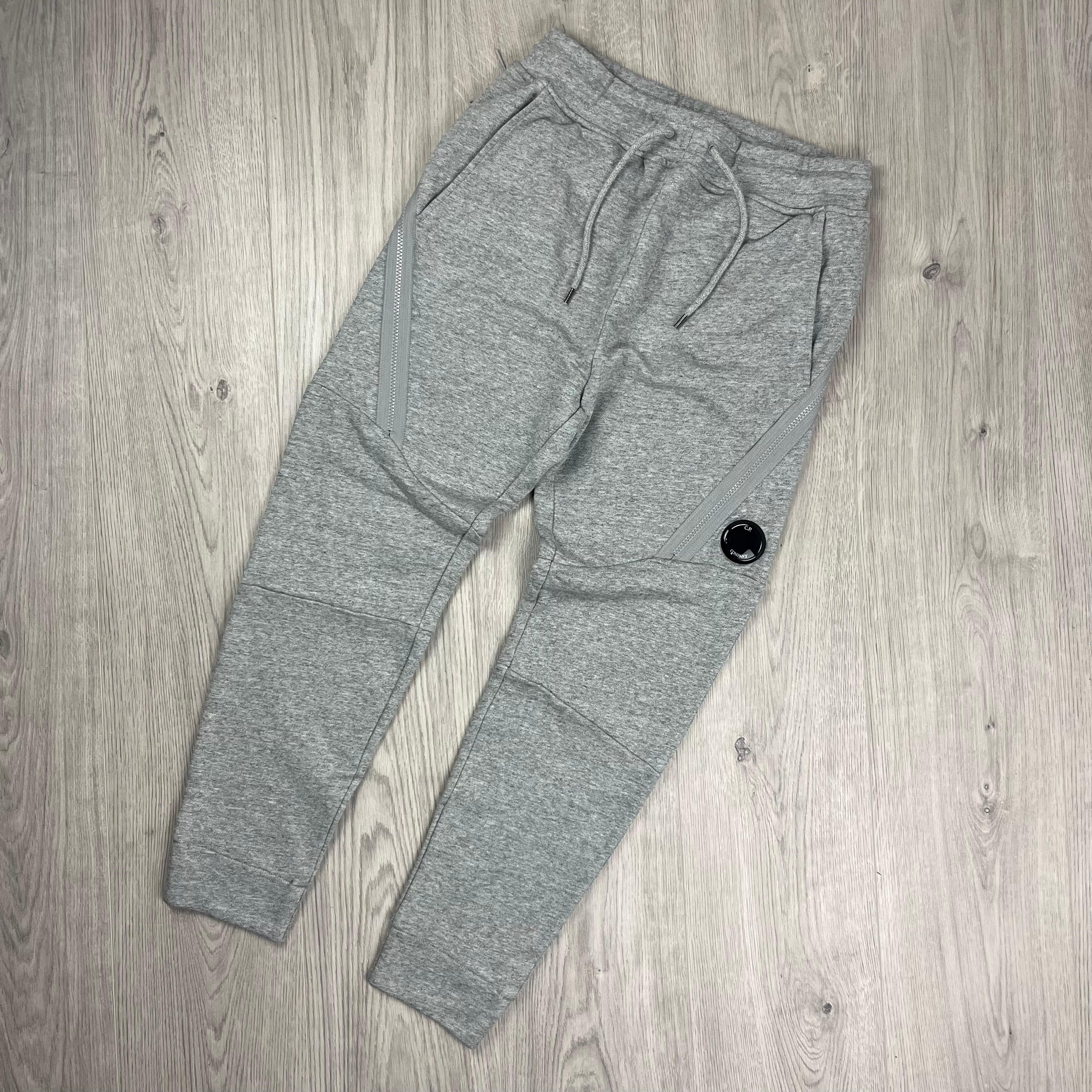 CP Company Zip Sweatpants in Greystone Melange. On sale at Open Attire.