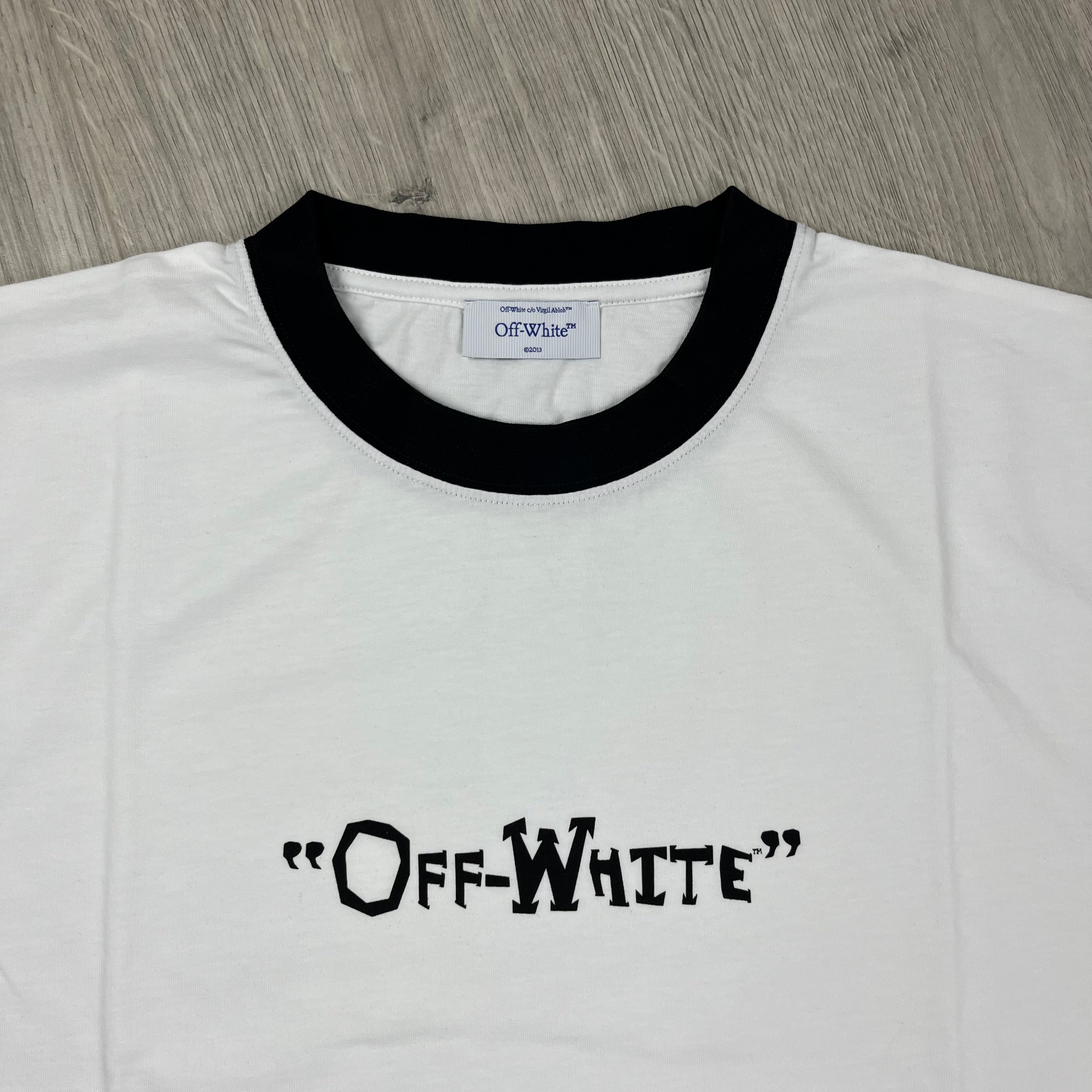 Off-White c/o Virgil Abloh Quote T-Shirt in White. On sale at Open Attire.