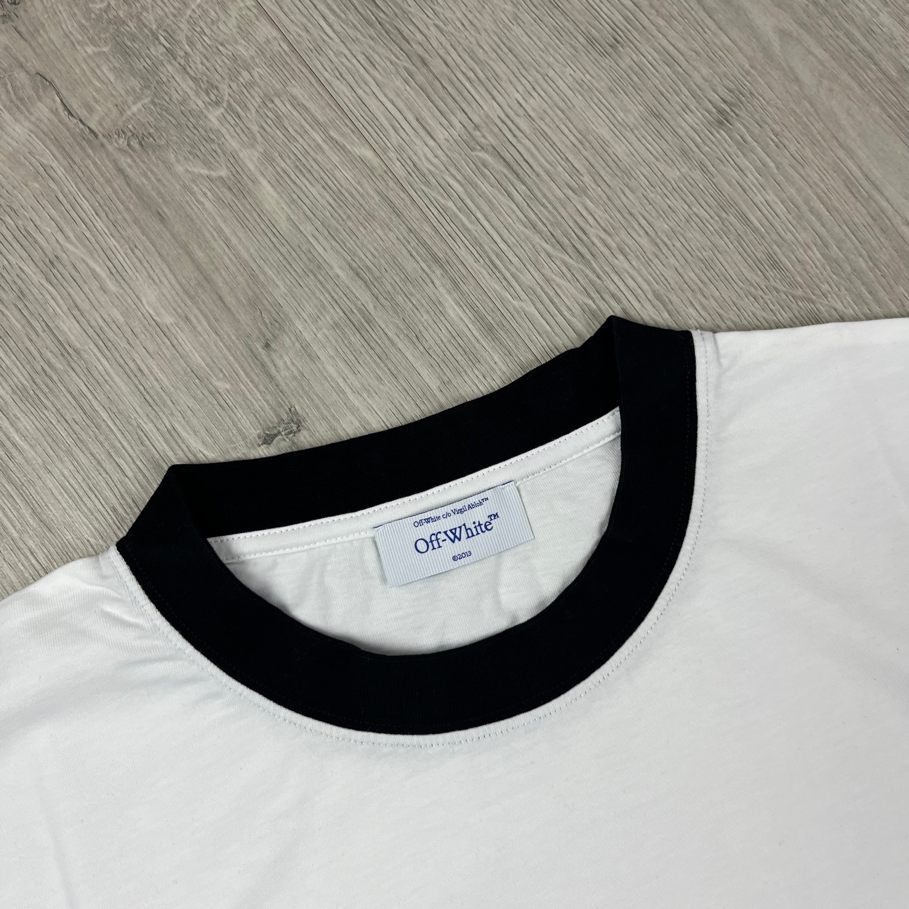 Off-White c/o Virgil Abloh Quote T-Shirt in White. On sale at Open Attire.