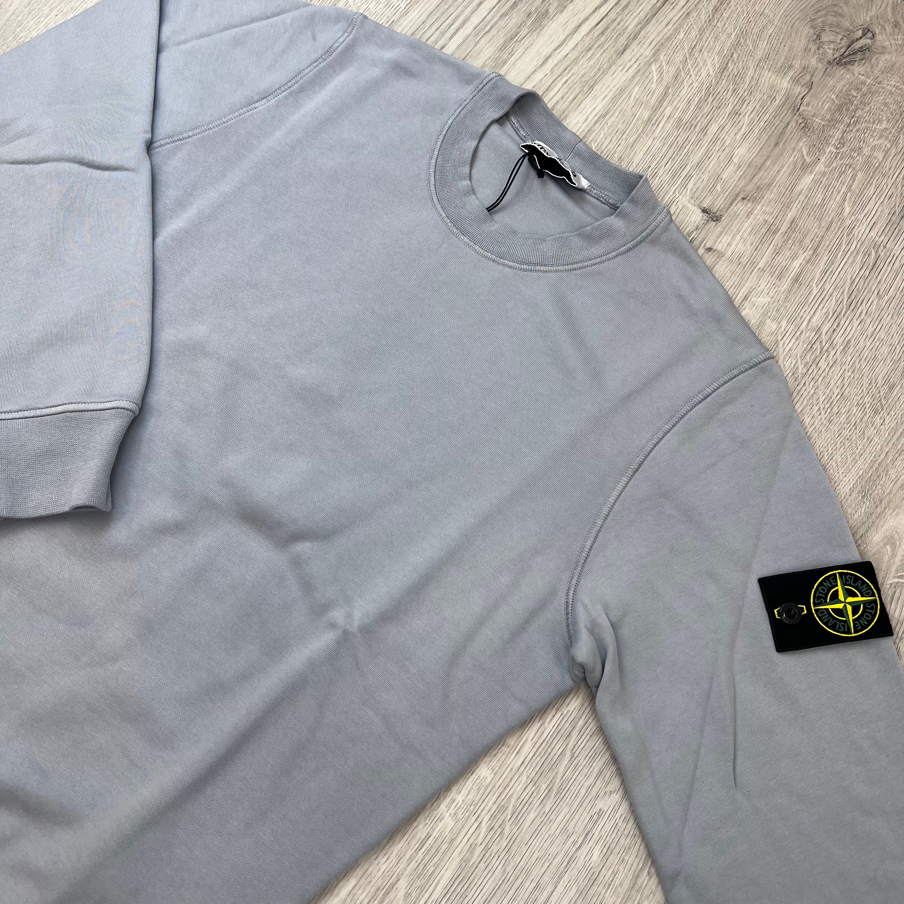 Angled view of the Stone Island Crewneck Sweatshirt in Ash Grey.