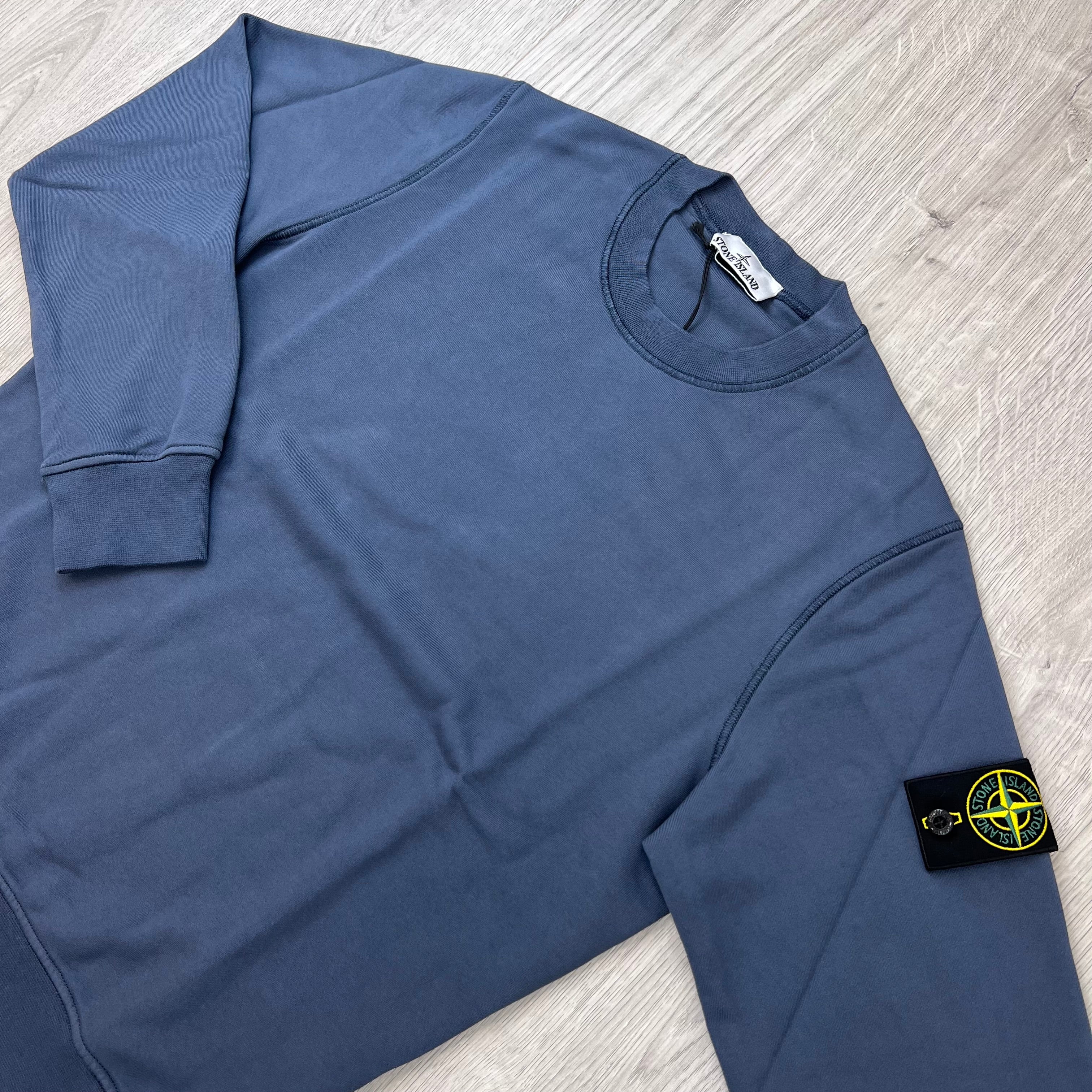 Angled view of the Stone Island Crewneck Sweatshirt in Slate Blue.