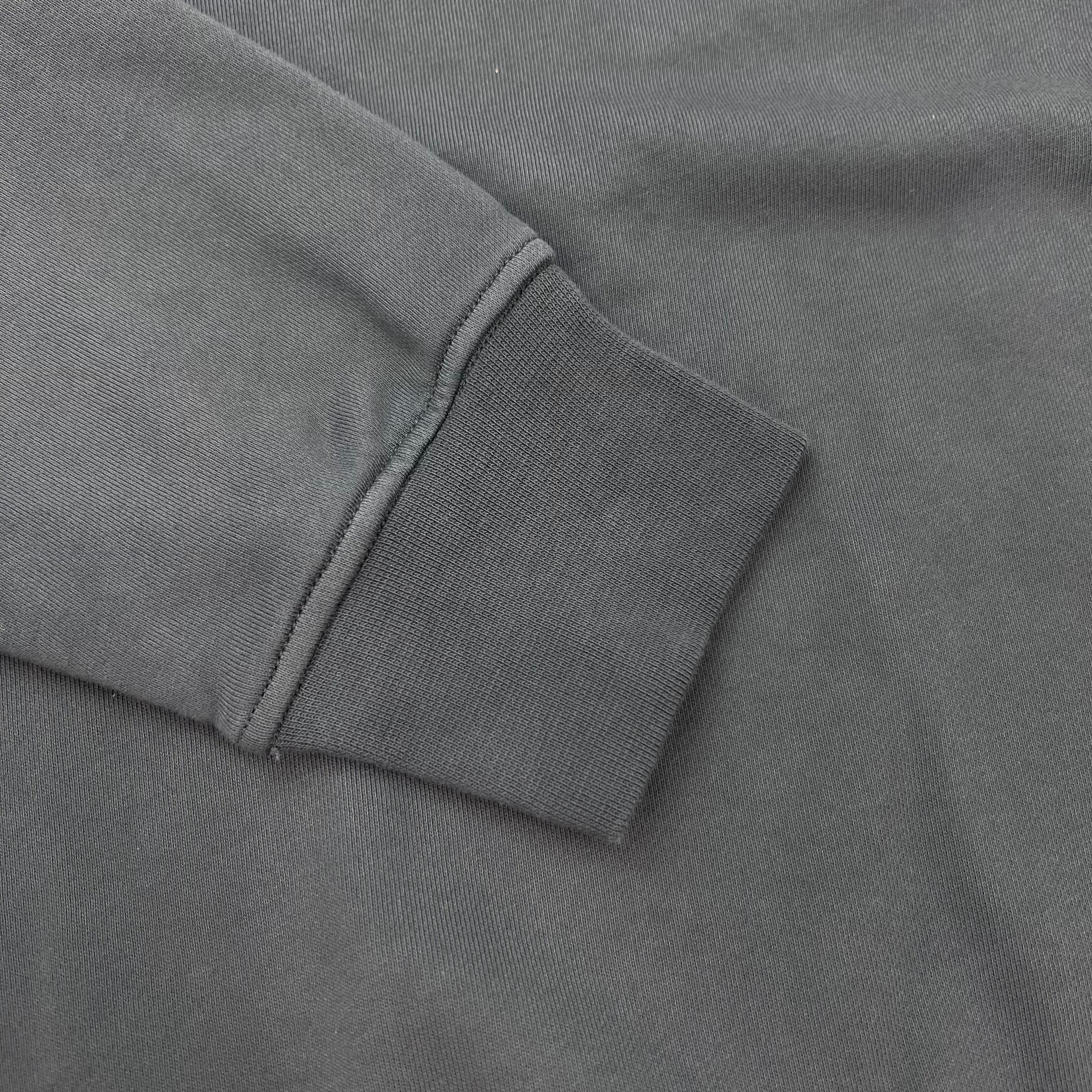 A close up view of the cuffs on a Stone Island Crewneck Sweatshirt in Slate Blue.