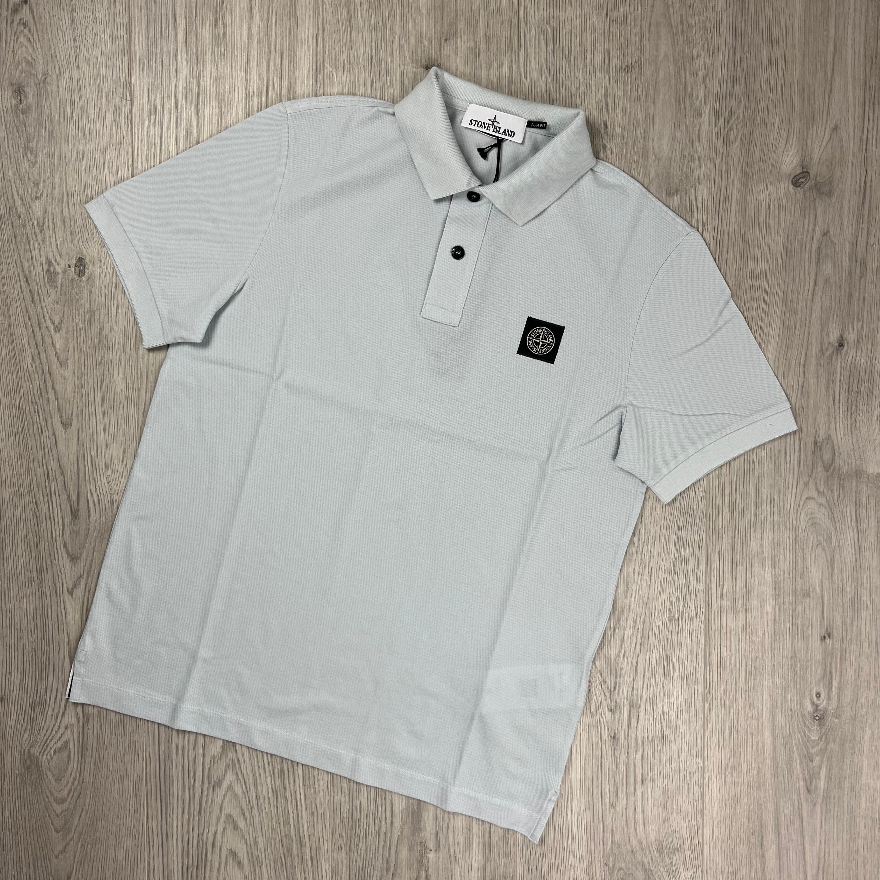 Stone Island Piqué Patch Polo Shirt in Sky Blue. On sale at Open Attire.